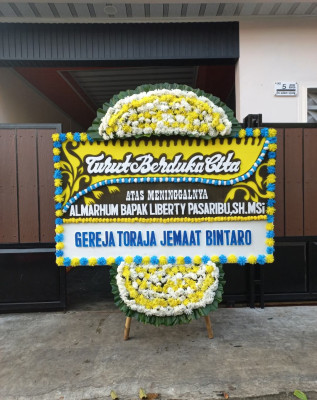 Papan Bunga Duka di Cikelat
